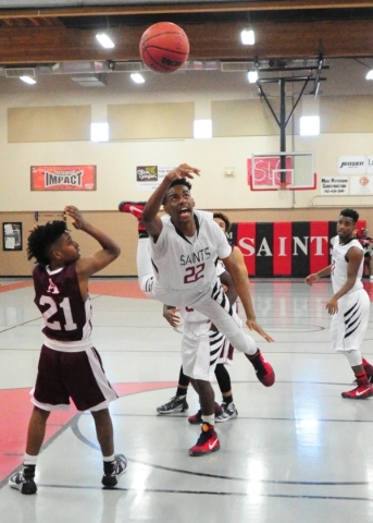 Mountain View Christian School guard Tyrell Brooks (22) looses his balance while driving to ...