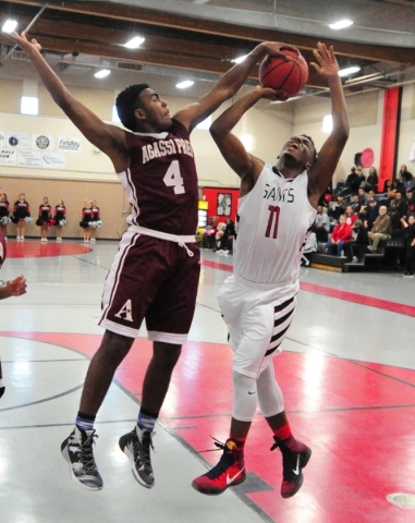 Mountain View Christian School forward C.J. Francis (4) blocks a shot from Mountain View Chr ...