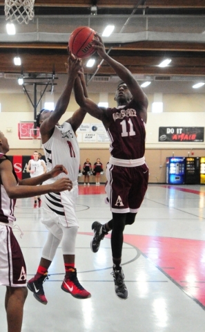 Agassi Prep guard Dion Binion, left, grabs a rebound against Mountain View Christian School ...