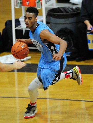 Centennial guard Troy Brown (0) drives to the basket against Durango in the fourth quarter o ...