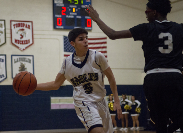 Lake Mead‘s Austin Newby (5) passes the ball around Mountain View‘s Terrence Bro ...