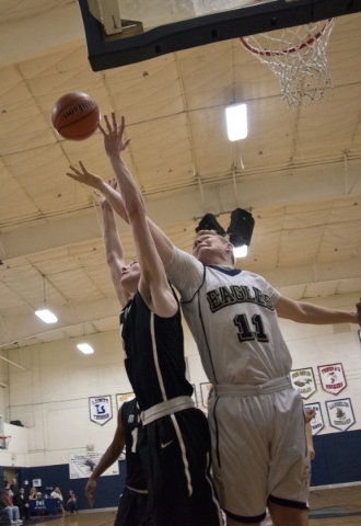 Lake Mead‘s Mitch Dolinar (11) and Mountain View‘s Christian Bennett (1) go for ...