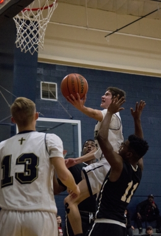 Lake Mead‘s Austin Newby (5) takes the ball to the basket during their home game again ...