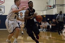 Mountain View‘s Tevin Gray (11) works the ball around Lake Mead‘s Mitch Dolinar ...