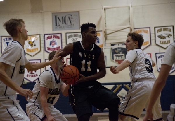 Mountain View‘s Tevin Gray (11) looks to get the ball to a teammate during their game ...