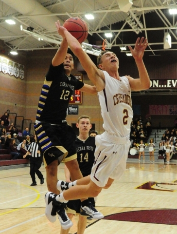 Sierra Vista forward Maui SeraJosef (12) strips the ball away from Faith Lutheran guard Blak ...