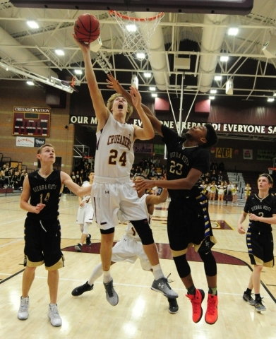 Faith Lutheran forward Bryce Neagle (24) goes up for a shot against Sierra Vista forward Chr ...