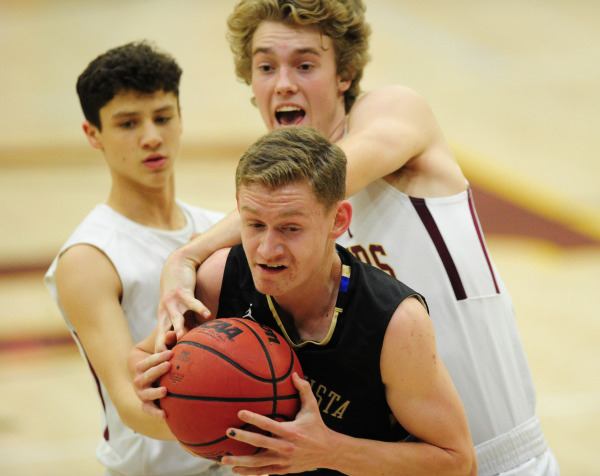 Faith Lutheran forward Bryce Neagle (24) tries to strip the ball away from Sierra Vista guar ...