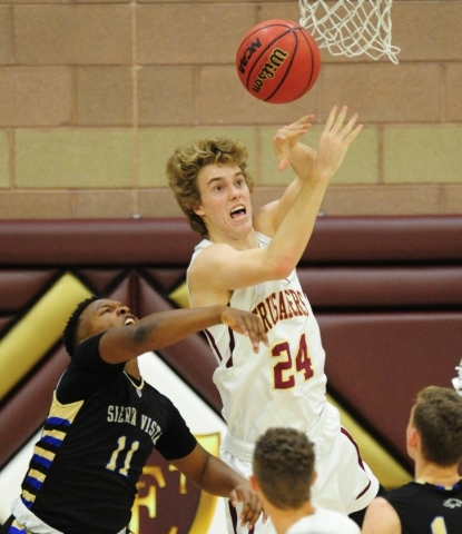 Faith Lutheran forward Bryce Neagle (24) and Sierra Vista guard Davion Hollis (11) fight for ...