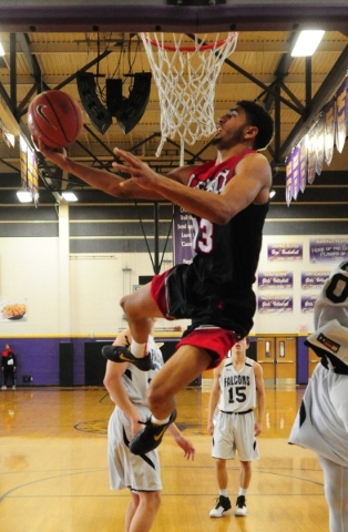 Liberty guard Dyllan Robinson (13) goes up for a shot against Coral Academy in the first hal ...