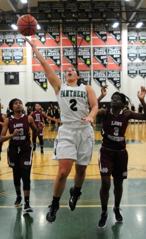 Palo Verde guard Brooklyn Cruz (2) makes a layup in front of Cimarron-Memorial forward Chard ...