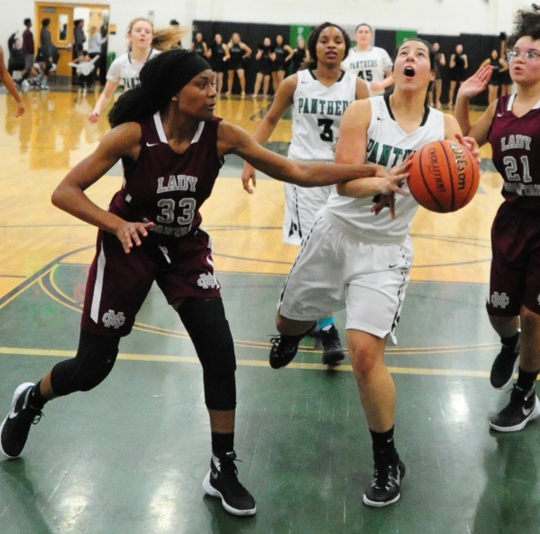 Cimarron-Memorial guard Amoura Whitney (33) fouls Palo Verde guard Brooklyn Cruz in the firs ...