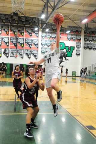 Palo Verde guard Paulina Silcox (11) goes up for a shot against Cimarron-Memorial guard Ashl ...