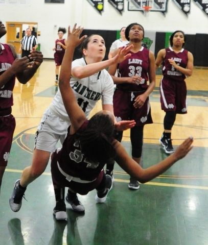 Cimarron-Memorial forward Tasia Moore (34) fouls Palo Verde guard Paulina Silcox in the seco ...