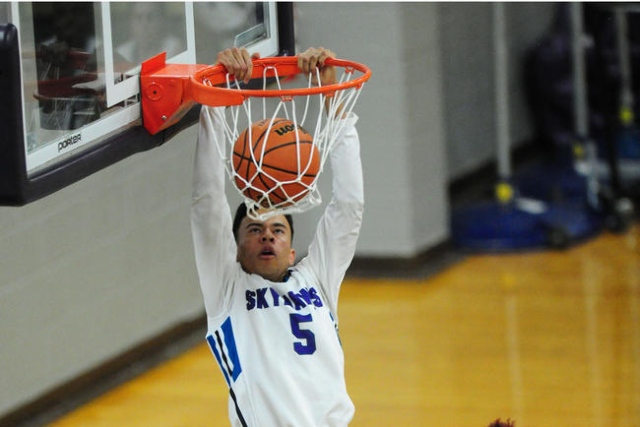 Silverado guard Matthew Arnold dunks against Canyon Springs in the fourth quarter of their p ...