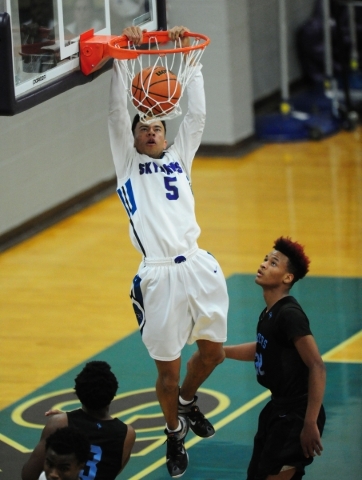 Silverado guard Matthew Arnold dunks against Canyon Springs in the fourth quarter of their p ...