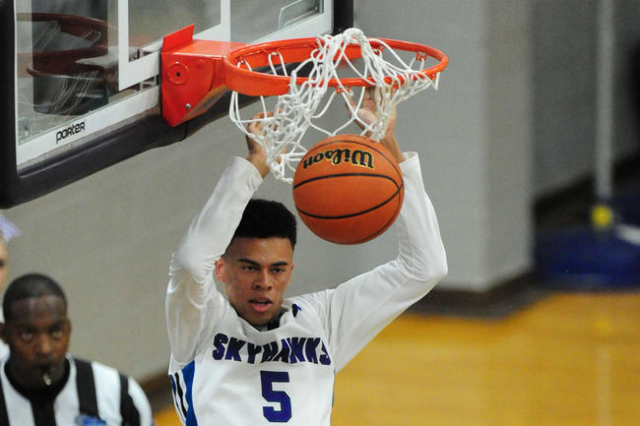 Silverado guard Matthew Arnold dunks against Canyon Springs in the fourth quarter of their p ...