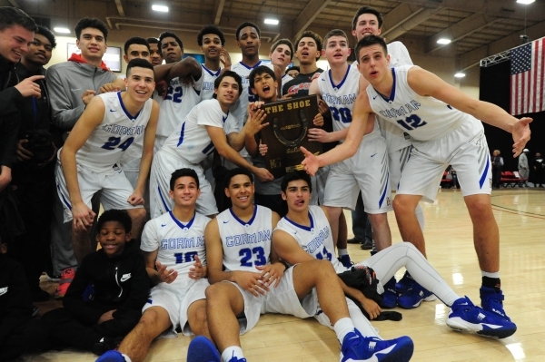 Bishop Gorman players pose with "The Shoe" trophy after defeating Findlay Prep dur ...