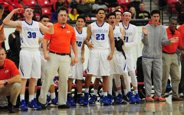 The Bishop Gorman bench reacts after taking the lead from Findlay Prep in the second quarter ...