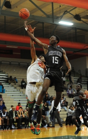 Cheyenne wing Dewayne Alexander (15) goes up for a shot against Mojave guard Lamaja Cunningh ...