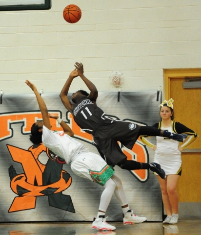 Cheyenne guard Laron Perkins (11) is upended after fouling Mojave guard Richard Edwards in t ...