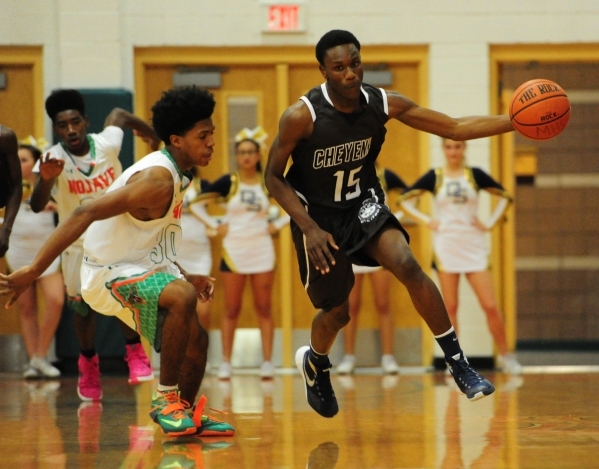 Cheyenne wing Dewayne Alexander (15) intercepts a Mojave pass in front of guard Lamaja Cunni ...