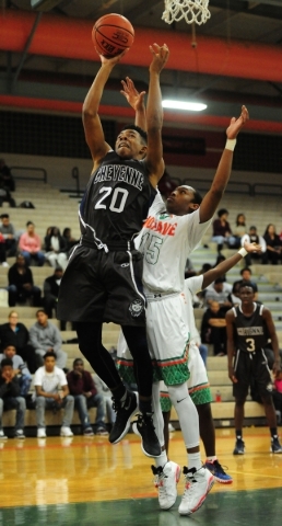 Cheyenne forward William Federson (20) goes up for a shot against Mojave guard Richard Edwar ...