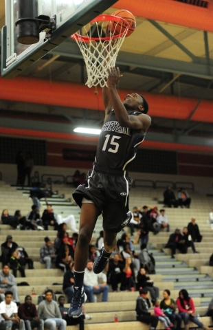 Cheyenne wing Dewayne Alexander (15) scores a field goal on a fast-break layup against Mojav ...