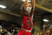 Desert Oasis forward Jacob Heese dunks over Arbor View guard Jarrod Burks in the second quar ...