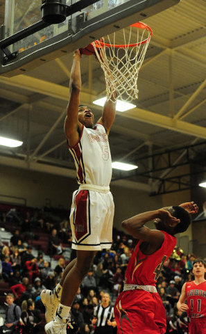 Desert Oasis forward Aamondae Coleman (5) dunks in front of Arbor View guard Favor Chukwulel ...