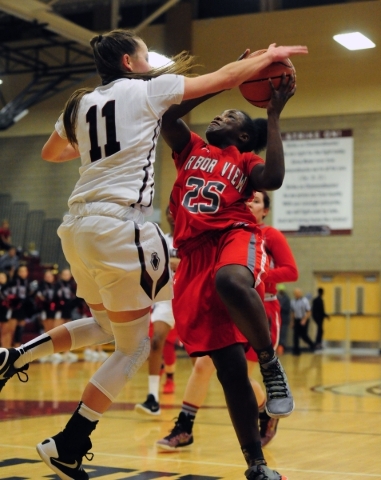 Desert Oasis guard Ashlynn Sharp (11) fouls Arbor View guard Alaysia Reed (25) in the third ...