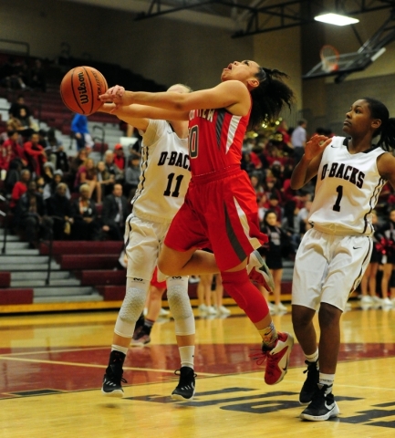 Desert Oasis guard Ashlynn Sharp (11) fouls Arbor View guard Tiffani Smith (10) while guard ...