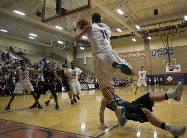 Legacy‘s Darious Dunson (11) passes the ball as he falls out of bounds during their ho ...