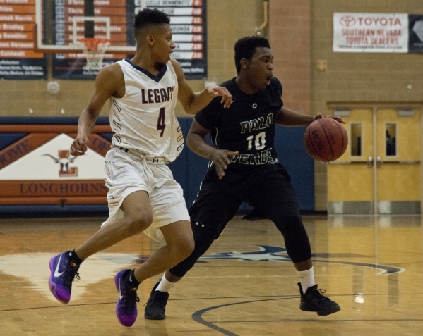 Palo VerdeÃ«s Joshua Darling (10) works the ball around Legacy‘s Anthone Searcy (4) ...