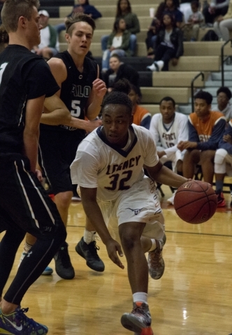 Legacy‘s Kameron Delgadillo (32) works the ball toward the basket during their home ga ...