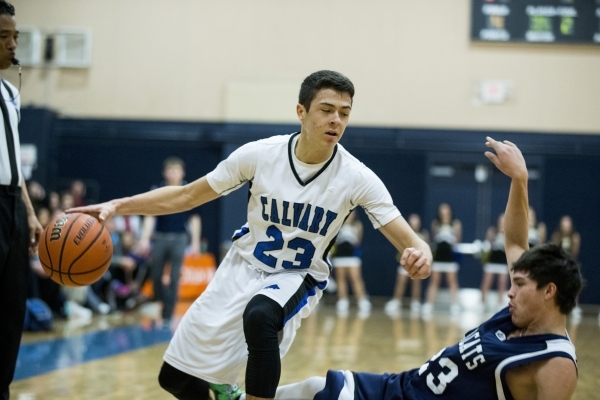 Calvary Chapel‘s Cameron Varela (23) makes his way to the basket in the boy‘s ba ...