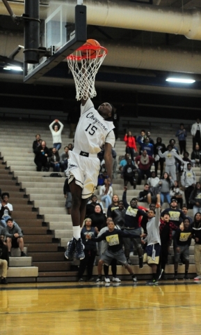 Cheyenne wing Dewayne Alexander dunks against Faith Lutheran in overtime of their prep baske ...