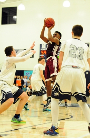 Agassi Prep forward Daniel Plummer (4) makes the game winning field goal with seconds remain ...