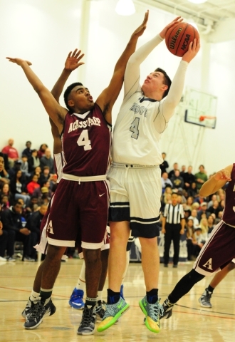 The Meadows forward Joe Epstein goes up for a shot against Agassi Prep forward Daniel Plumme ...