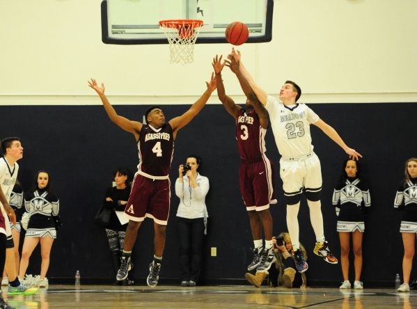 Agassi Prep forward Daniel Plummer (4), guard Stephan Laushaul (3), and The Meadows guard Ja ...