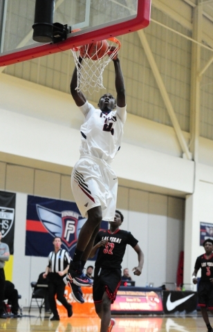 Findlay Prep guard Lamine Diane (24) dunks against Las Vegas in the second quarter of their ...