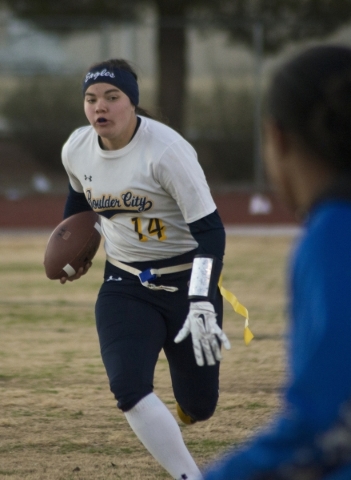 Boulder City quarterback Jeanne Carmell (14) runs the ball up the field during their game ag ...