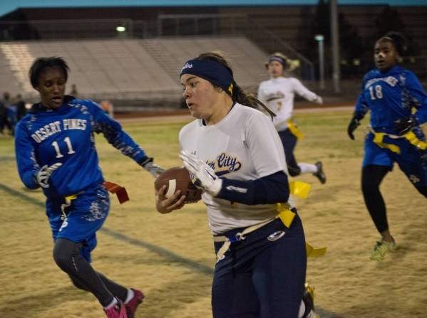 Boulder City‘­s Jeanne Carmell (14) looks to get by Desert Pines‘ Tanaiya Hinto ...