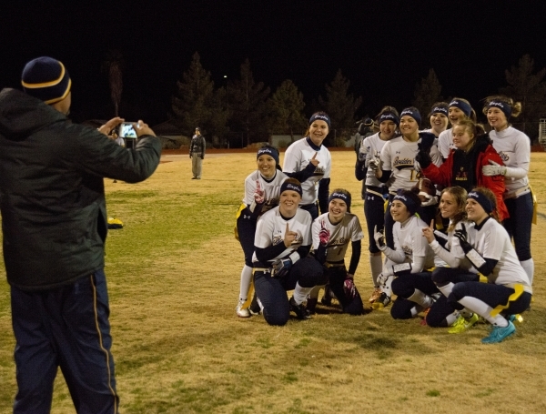 Boulder City High School flag football head coach Chris Morelli takes a photo of his team af ...