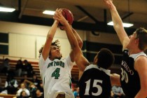 Green Valley guard Xavier Jarvis (4) goes up for a shot against Coronado forward Kennedy Koe ...