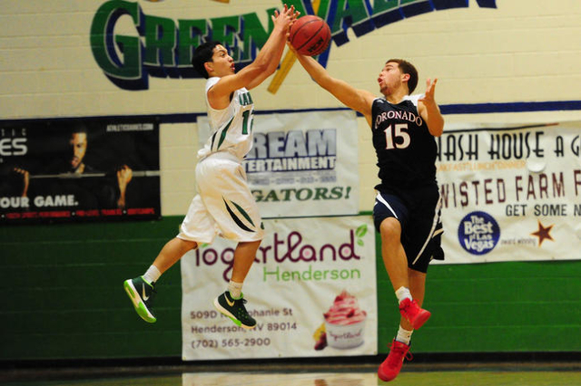 Coronado guard Bryce Savoy (15) intercepts a pass intended for Green Valley guard Steven Foj ...