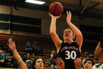 Coronado forward Kennedy Koehler (30) goes up for a shot against Green Valley guard Matt Tut ...