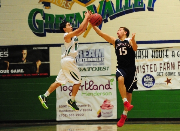 Coronado guard Bryce Savoy (15) intercepts a pass intended for Green Valley guard Steven Foj ...