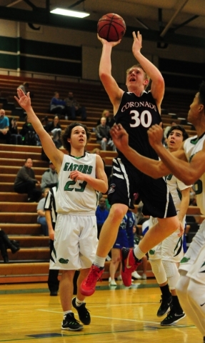 Coronado forward Kennedy Koehler (30) goes up for a shot against Green Valley guard Matt Tut ...