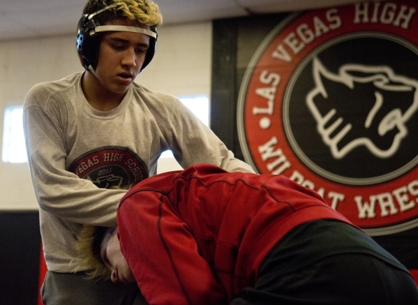 Antonio Saldate, left, spars with Nick Sablan during practice inside the wrestling room at L ...